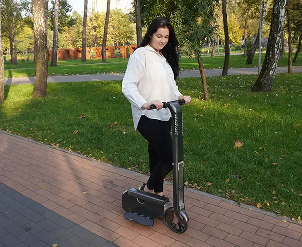 BooZter Folding Electric Scooter That Fits Into Your Backpack by WheelKinetic