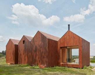 Small Cottage Near a Pond Was Inspired by Traditional Fisherman’s Cabins