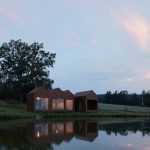 Small Cottage Near a Pond Was Inspired by Traditional Fisherman's Cabins by Studio A111