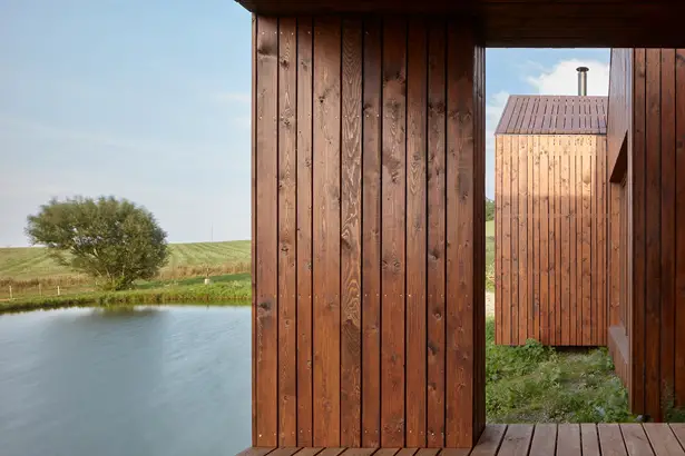 Small Cottage Near a Pond Was Inspired by Traditional Fisherman's Cabins by Studio A111