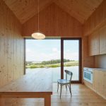 Small Cottage Near a Pond Was Inspired by Traditional Fisherman's Cabins by Studio A111