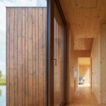 Small Cottage Near a Pond Was Inspired by Traditional Fisherman's Cabins by Studio A111