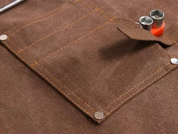 Heavy-Duty Waxed Canvas Apron Features Tool Pockets and Cross Back Straps