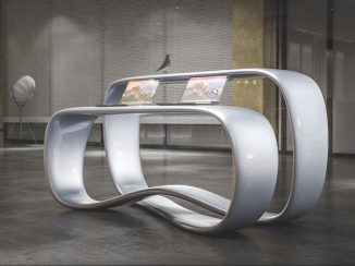 Ryra Reception Desk Plays With Continuous Loop Form to Create Dual-Surface Desk