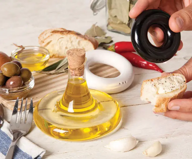 TABLE SET: Olive Oil, Salt and Pepper Containers Stacked Up Together